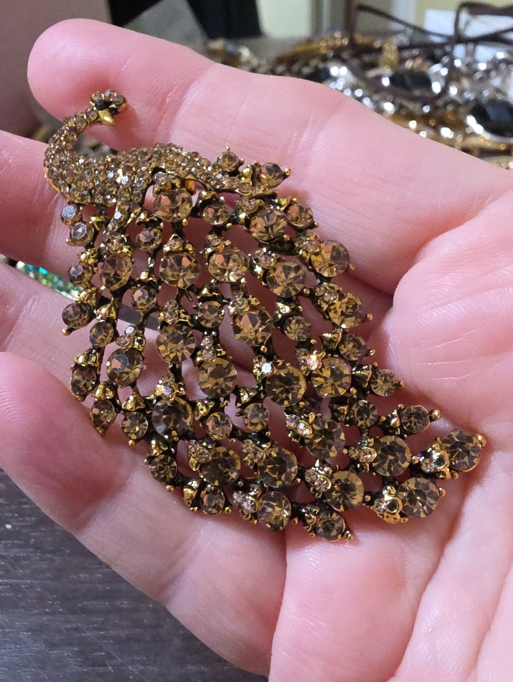 A113- Gold-Tone Crystal Peacock Brooch